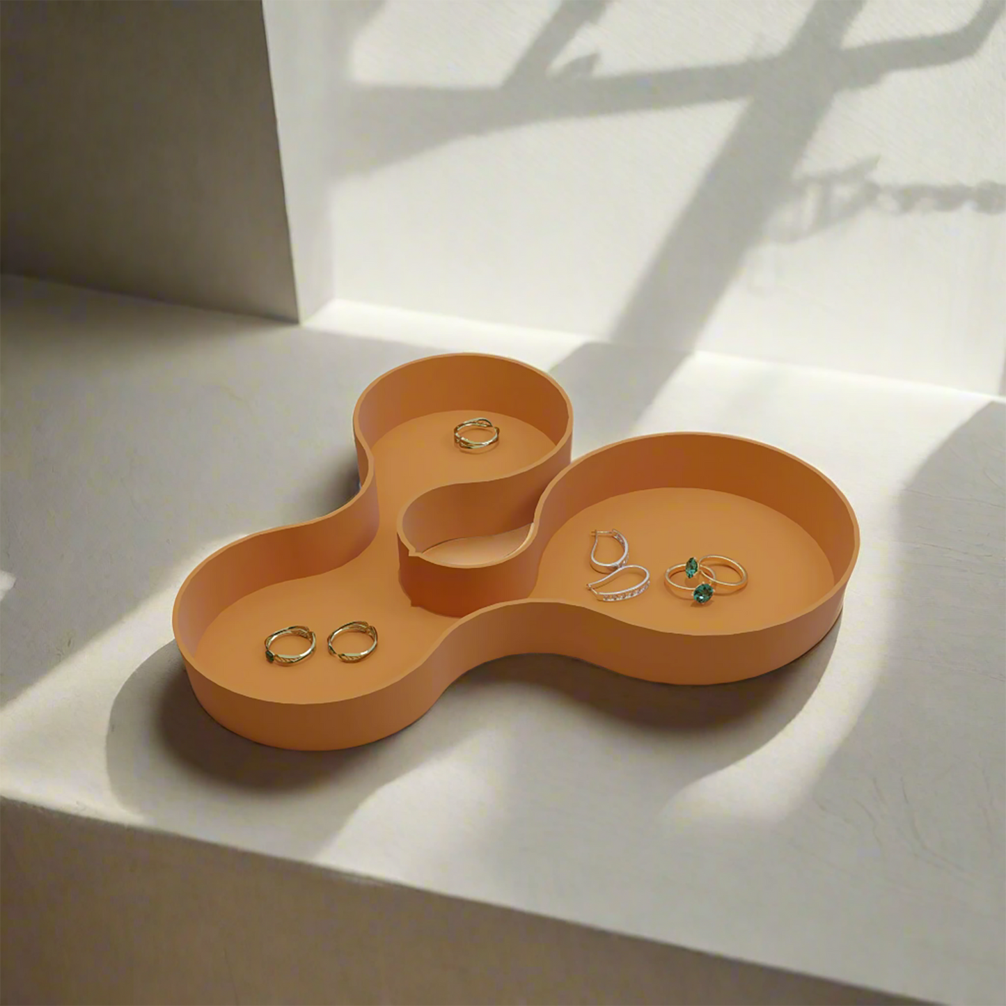 Coral crest tray in orange colour with some jewellery items in it