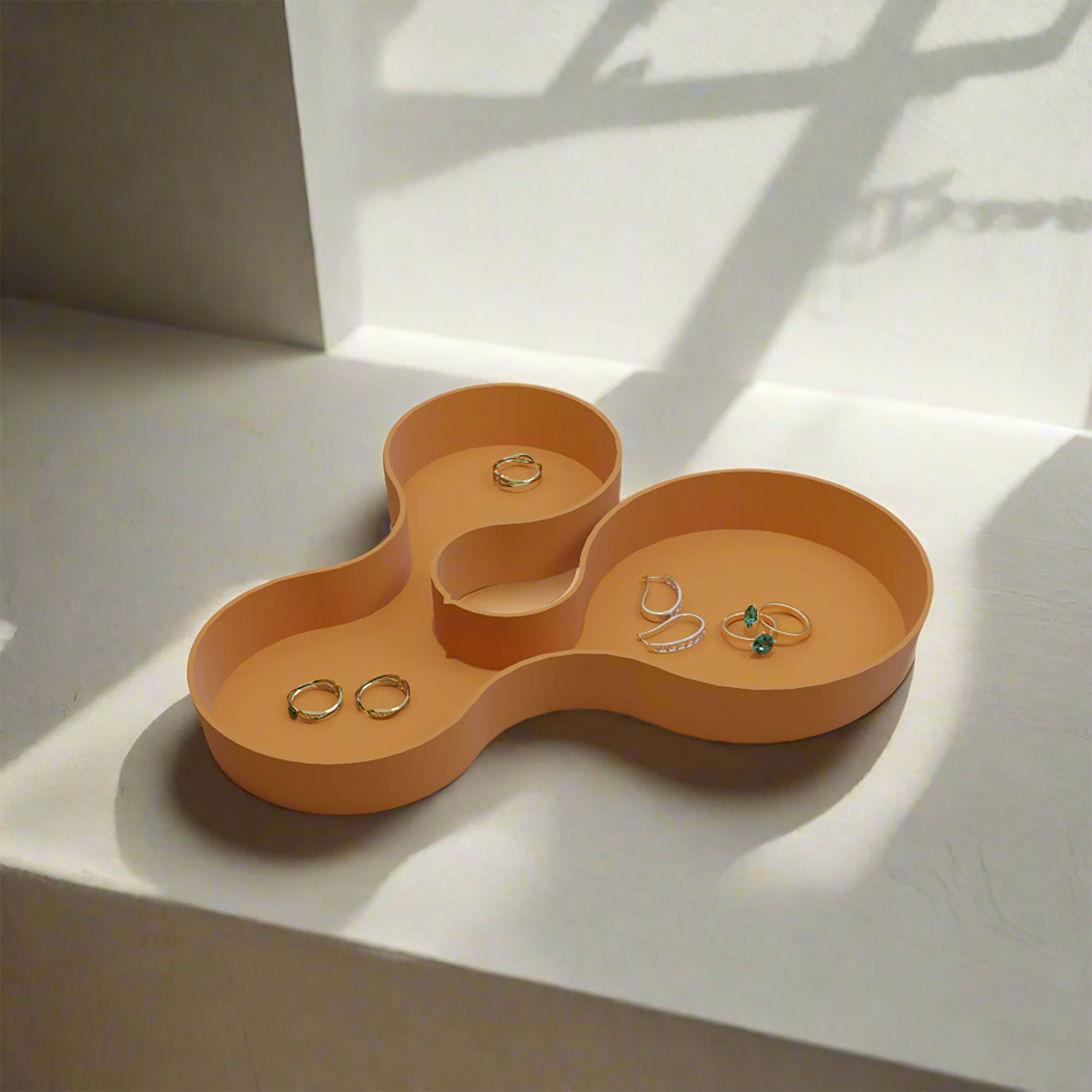 Coral crest tray in orange colour with some jewellery items in it