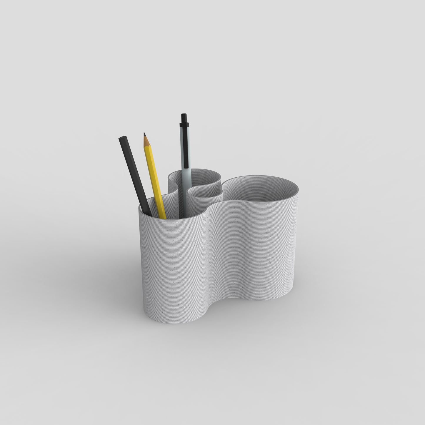 Coral Crest pot in marble used as a stationery holder with pens and pencils.