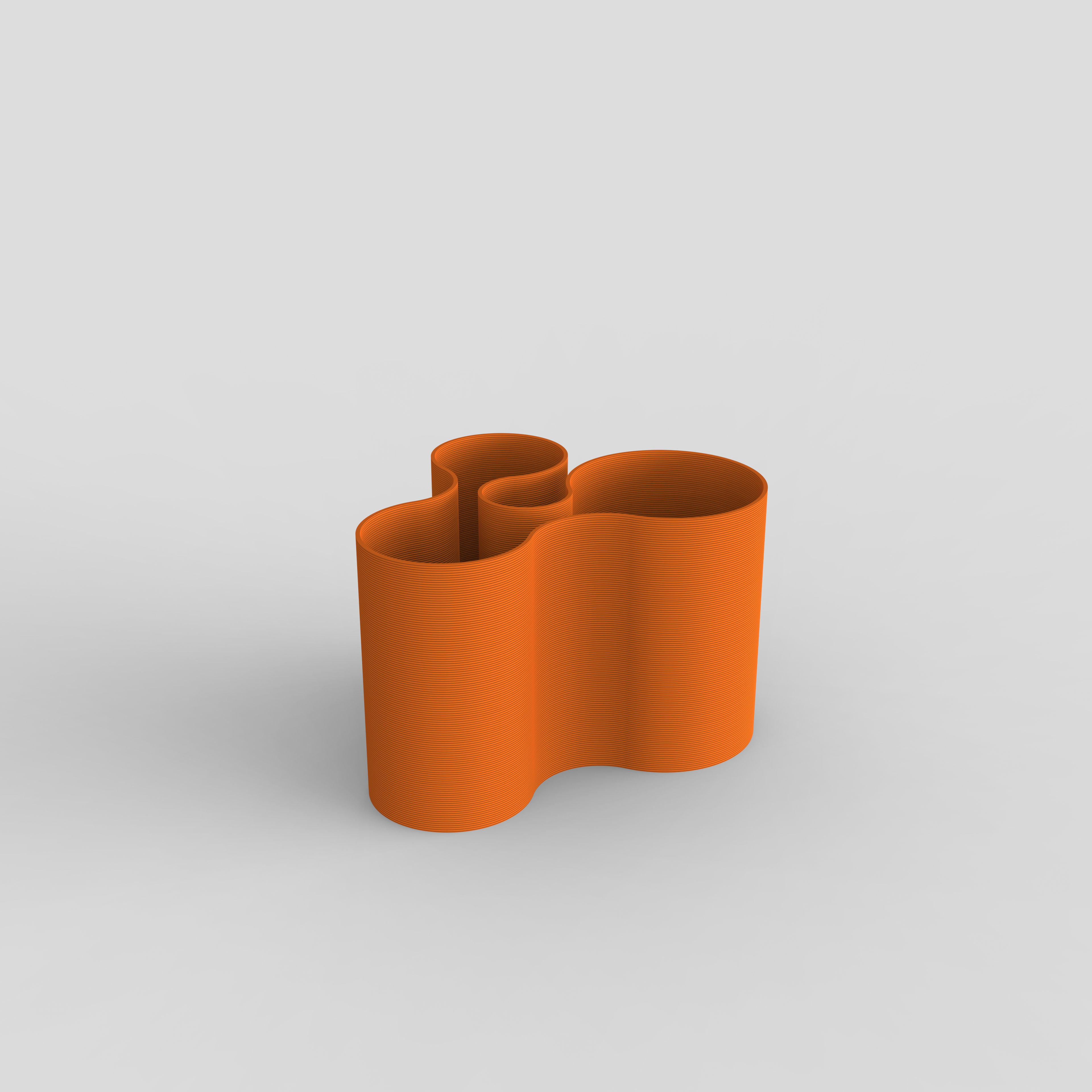 Multi-functional Coral Crest pot in Orange, holding stationery items.