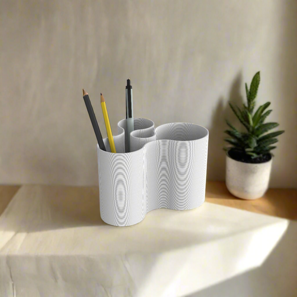 White Coral Crest pot utilized as a stylish stationery holder.