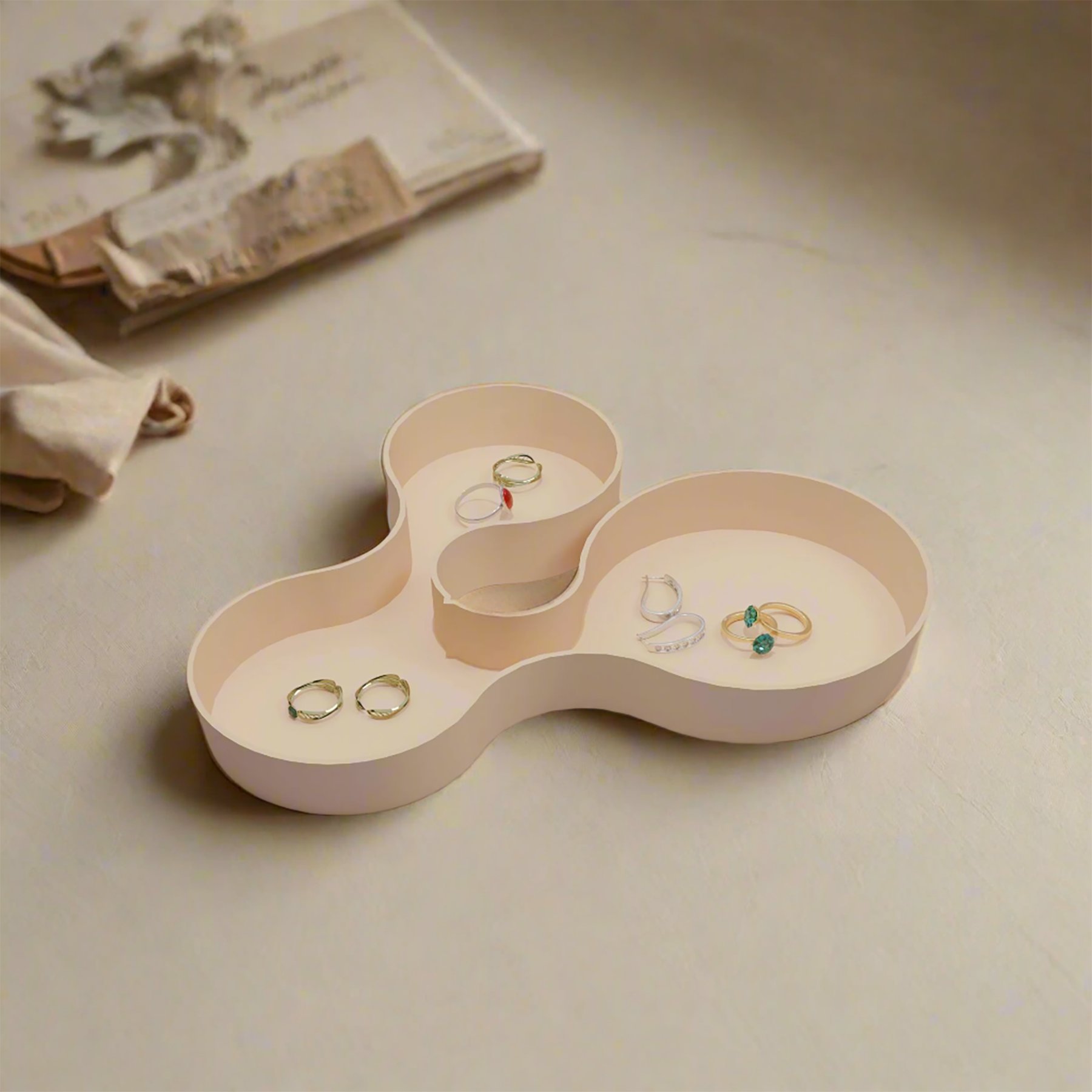 Coral crest tray in beige color with some jewellery in it