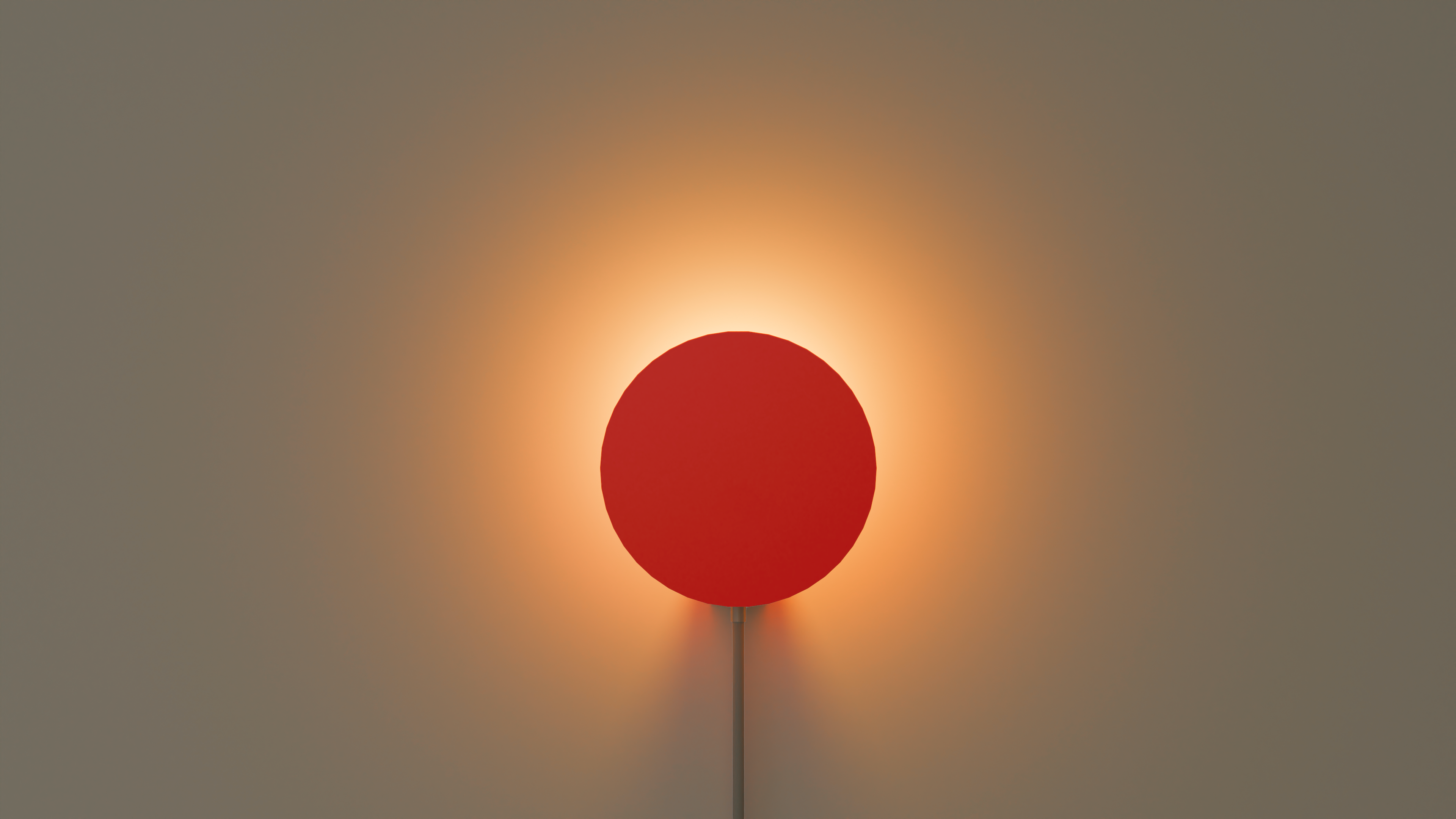 On shot of Halo Neo wall light in red with a halo effect on the wall behind