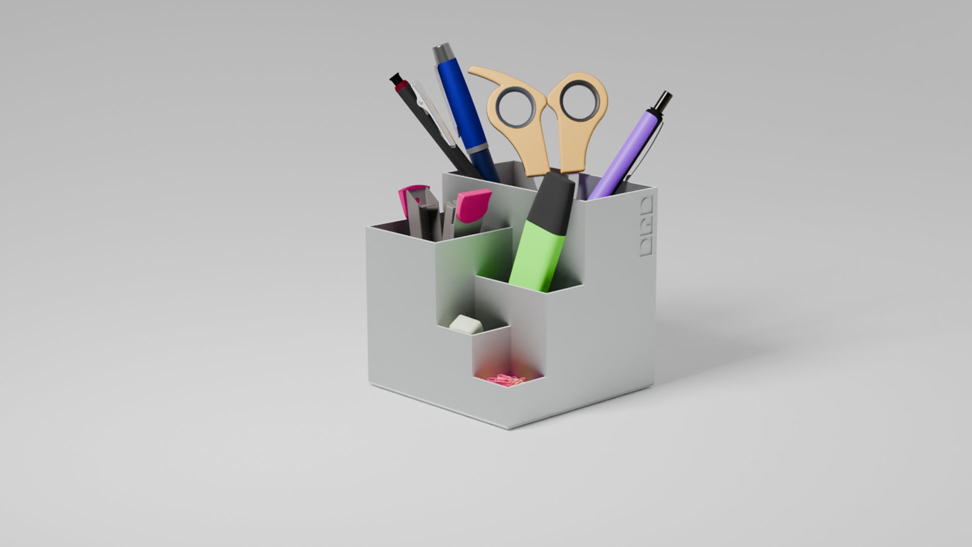 Organised white penholder with stationery items in it.