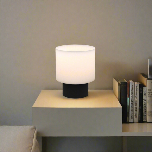 On shot of poco circle wired table lamp in black color placed on a bedside table
