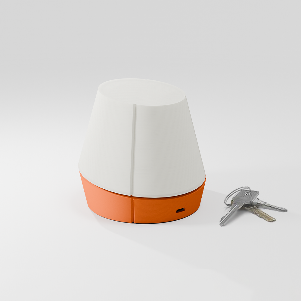 off shot of Litele portable lamp in orange color along with keys