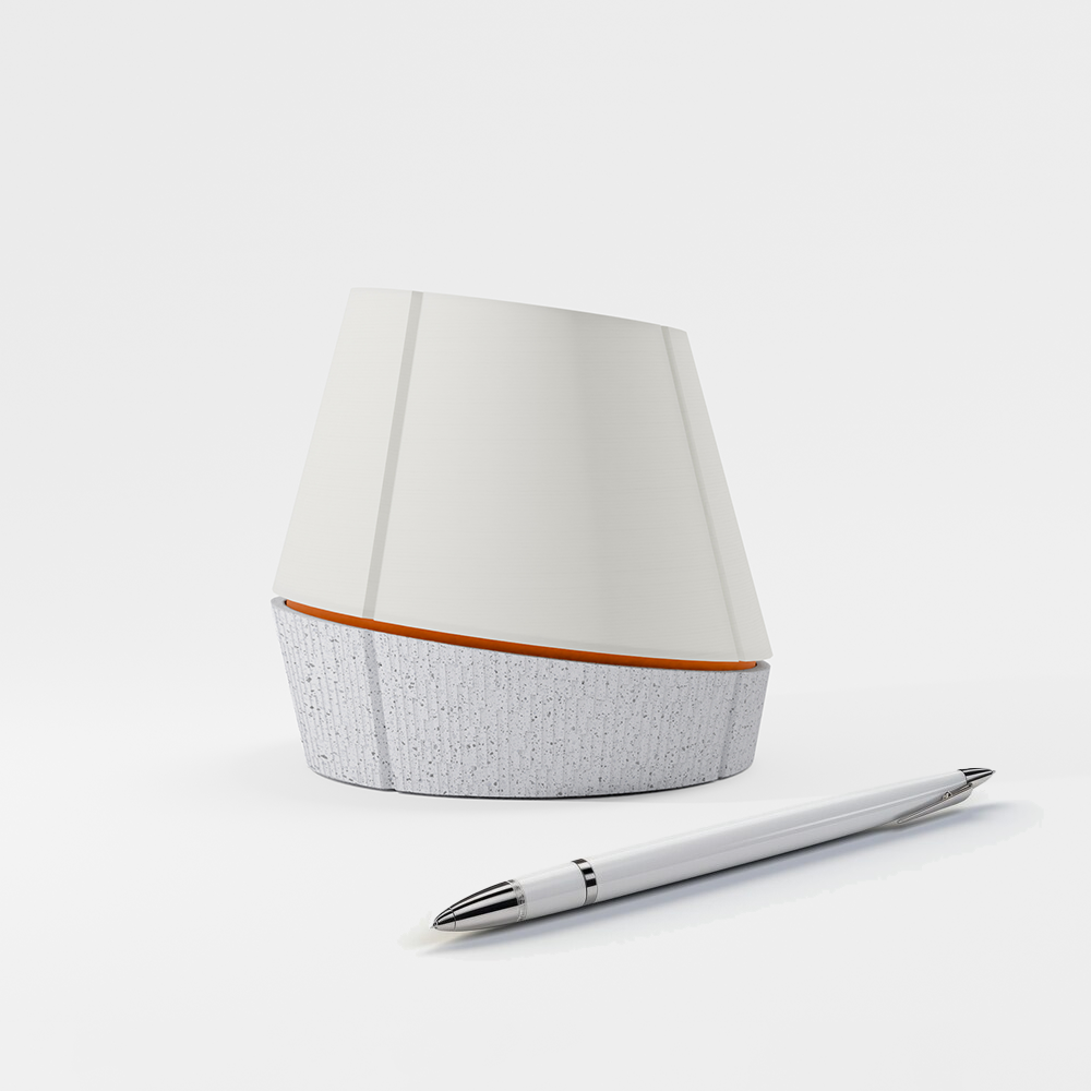 off shot of Litele portable lamp in marble color along with a pen