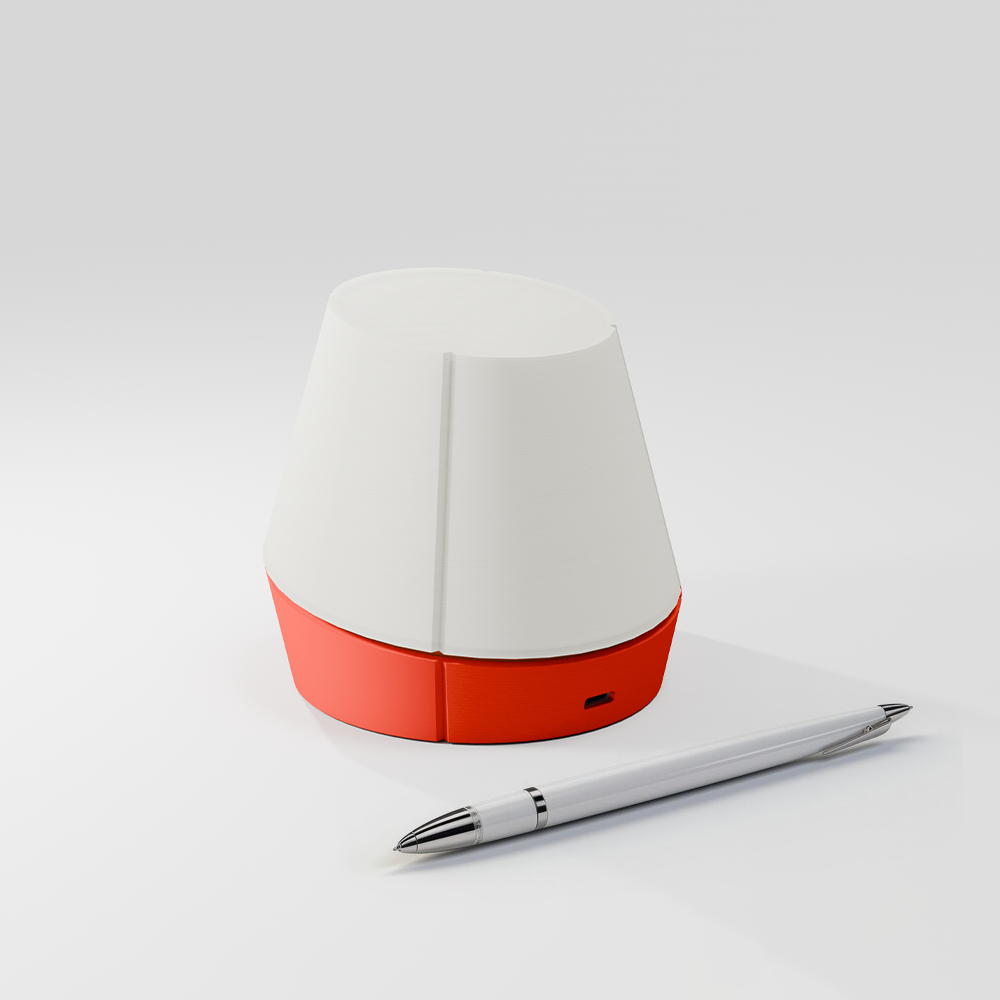 off shot of Litele portable lamp in red color along with a pen