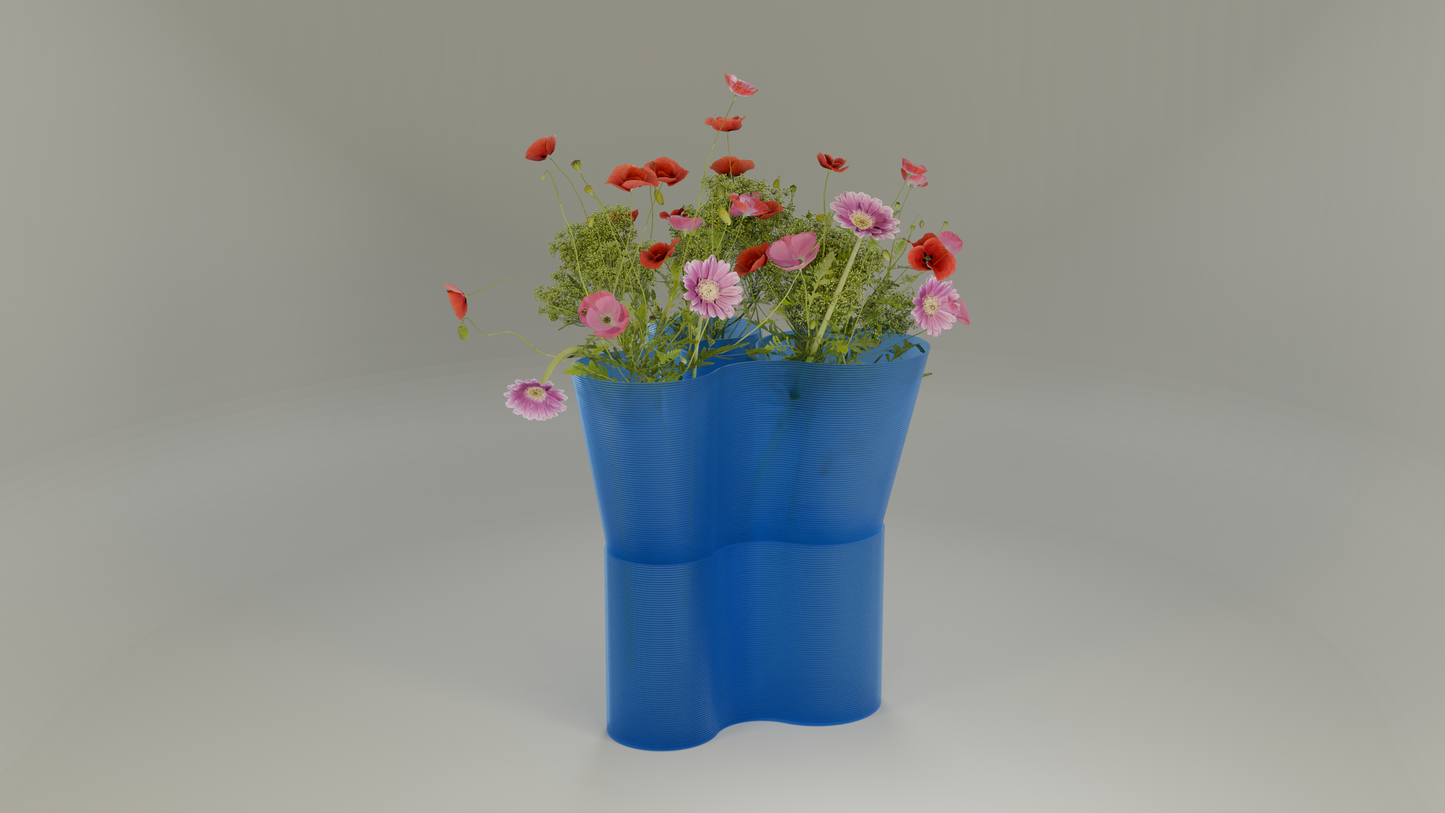 Paso Glo vase, a dual-sectioned blue coloured planter, unlit, holding red and pink flowers.