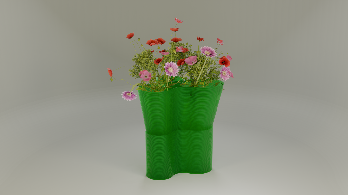 Paso Glo vase, a dual-sectioned green coloured planter, unlit, holding red and pink flowers.