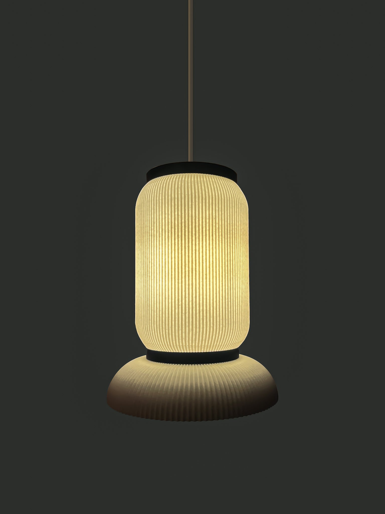 Bello L. A 3D Printed pendant light with a textured design on a dark background