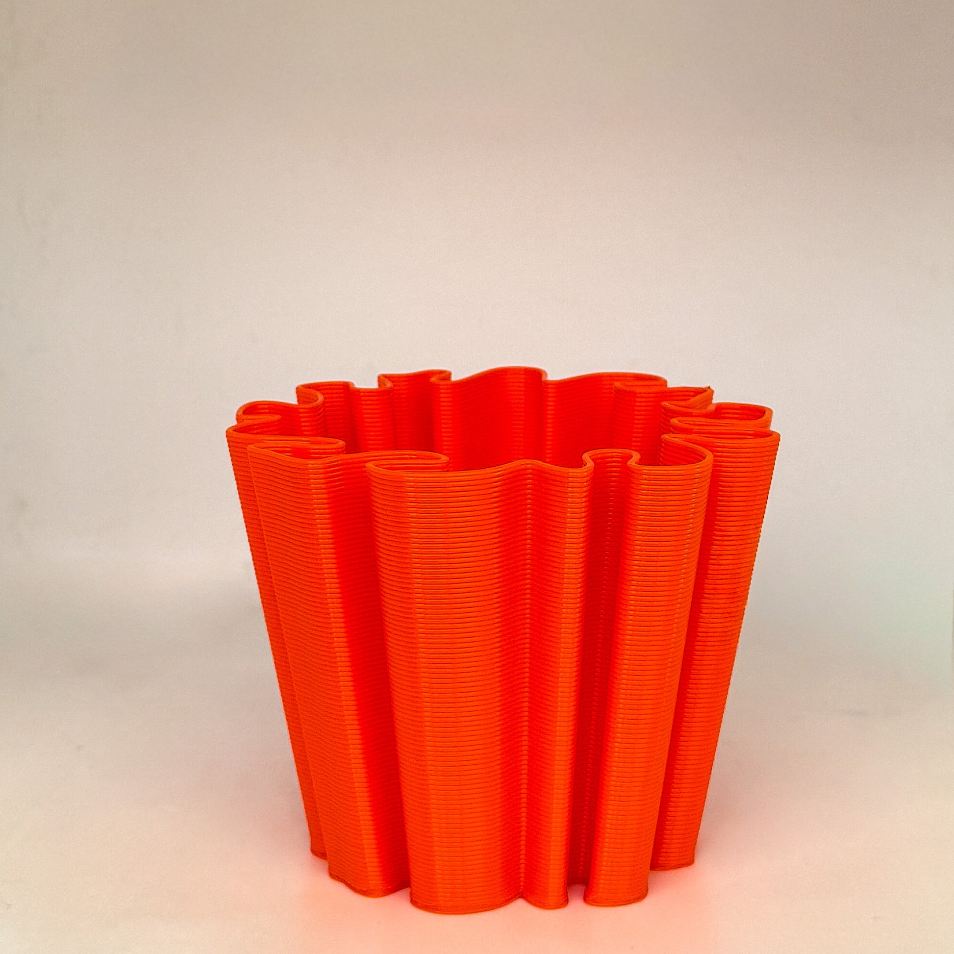 front view of coral vase in orange color
