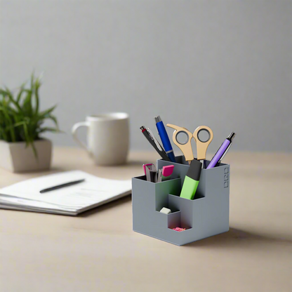 cube stationary holder in grey color with some stationary items