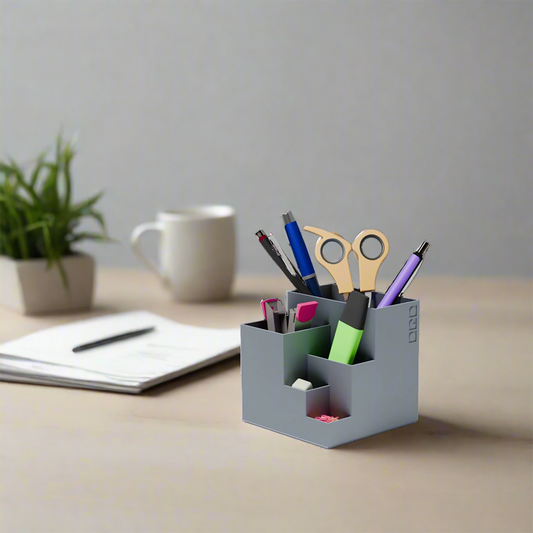 cube stationary holder in grey color with some stationary items