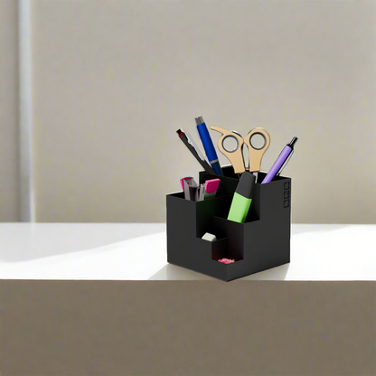 Cube stationary holder in black color with some stationary items in it