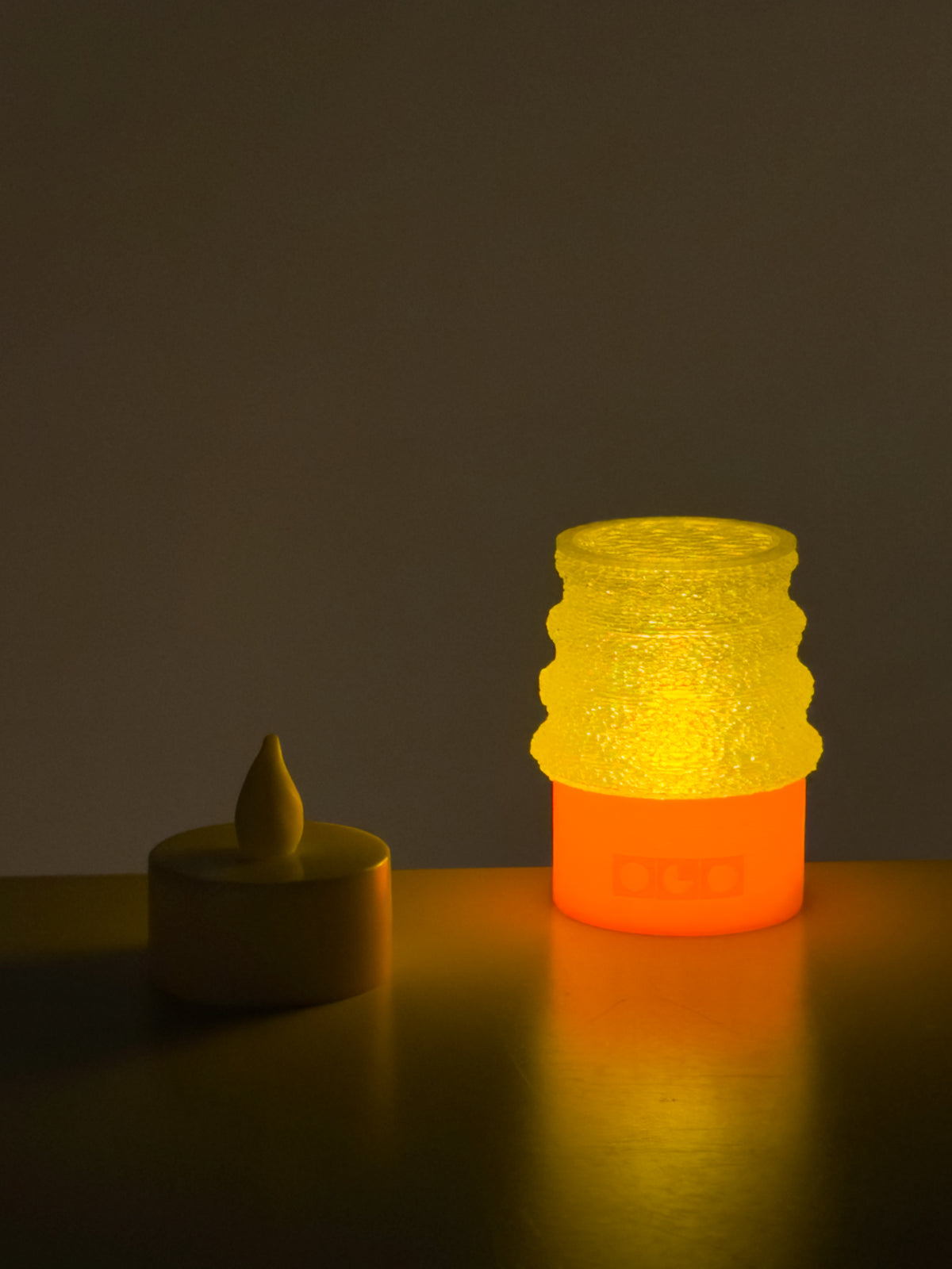 On shot of mini jello lamp with a small candle light beside