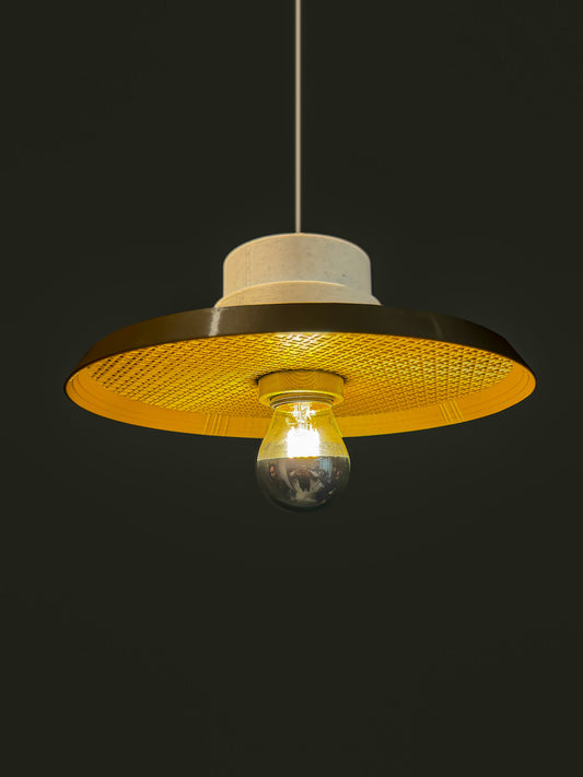 Ora Drop pendant light in bronze colour with a dark background