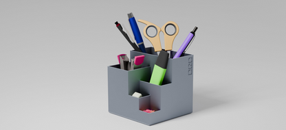Cube pen stand with multiple compartments holding stationary items