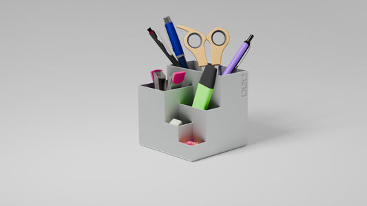 Organised white penholder with stationery items in it.