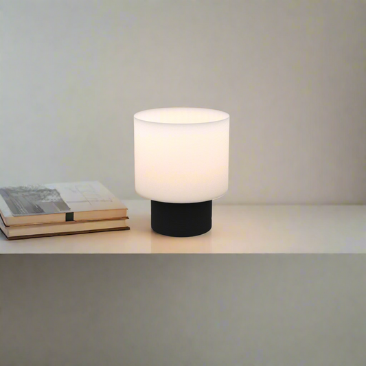 On shot of poco circle wired table lamp in black color along with books