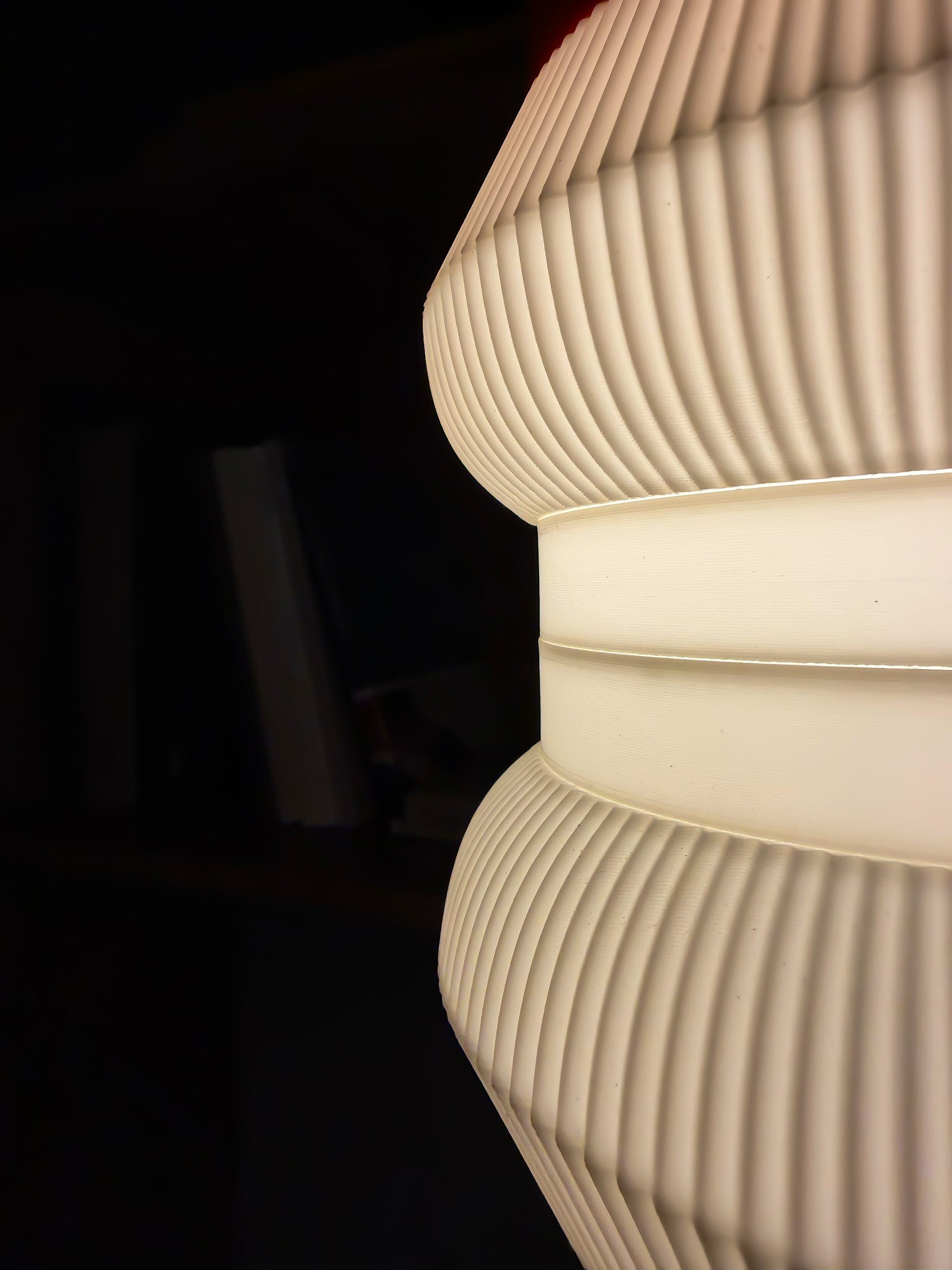 Close-up of textured white lampshade of stacko drop against a dark background