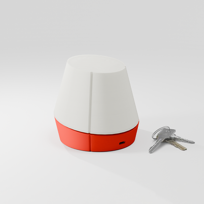 off shot of Litele portable lamp in red color along with keys