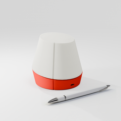 off shot of Litele portable lamp in red color along with a pen