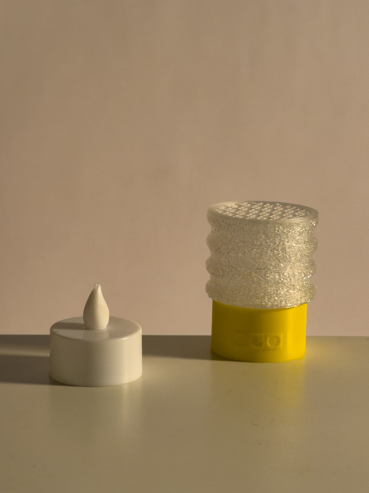 mini twist lamp with a small candle light beside