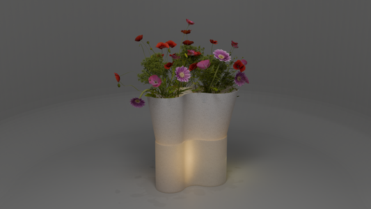 Paso Glo vase, a dual-sectioned marble coloured planter with a glowing base, holding red and pink flowers.